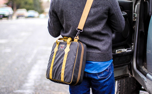 A person wearing the Founder's Briefcase crossbody.